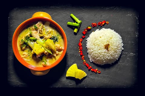 Poulet mit grüner Currysauce